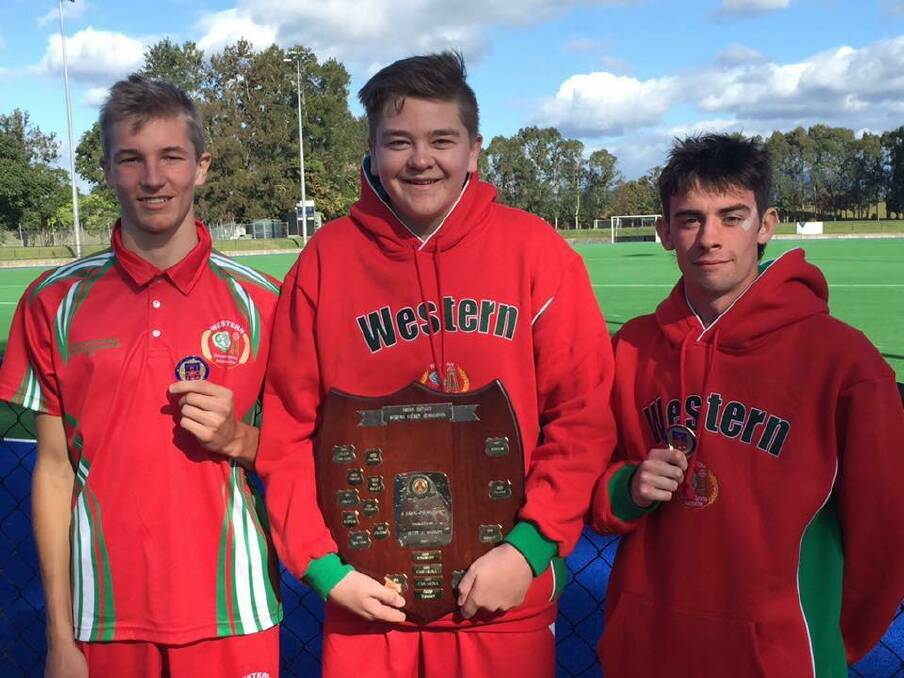 STATE CHAMPIONS: Lithgow High School students Logan Hunter, Mitchell Brain and Dane Gaffogg proudly displaying the spoils from their win. Picture: SUPPLIED