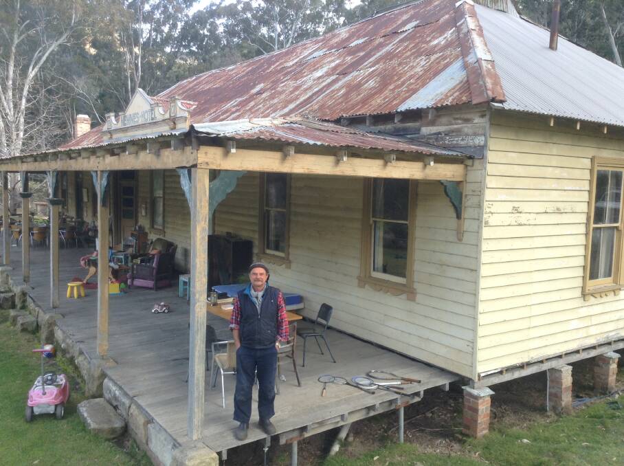 Newnes Hotel owner and manager Thomas Ebersoll below the rusting roof.