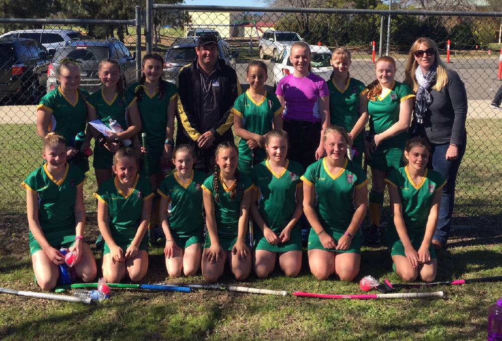 GIRLS IN GREEN: The Lithgow under 13 girls district hockey side at the state championships in Tamworth. Picture: SUPPLIED