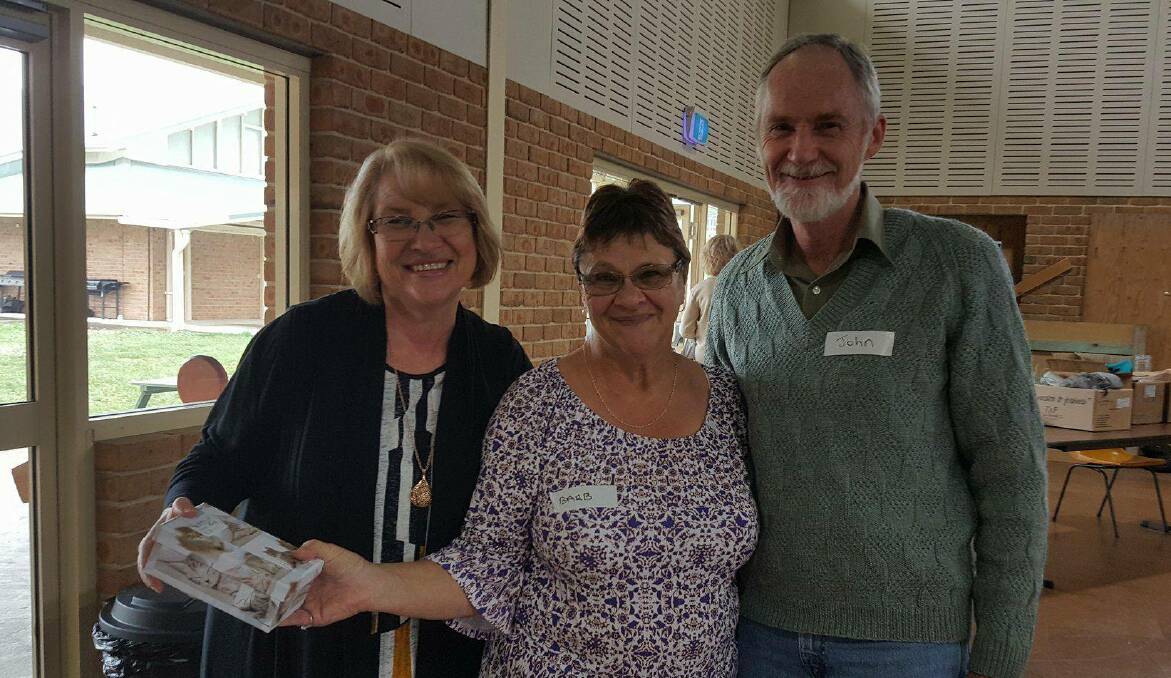 THANK YOU: Carol and John Stevens receive a donation from Barbara Kuncio (centre).  The concert raised a total of $1200. Pictures: SUPPLIED