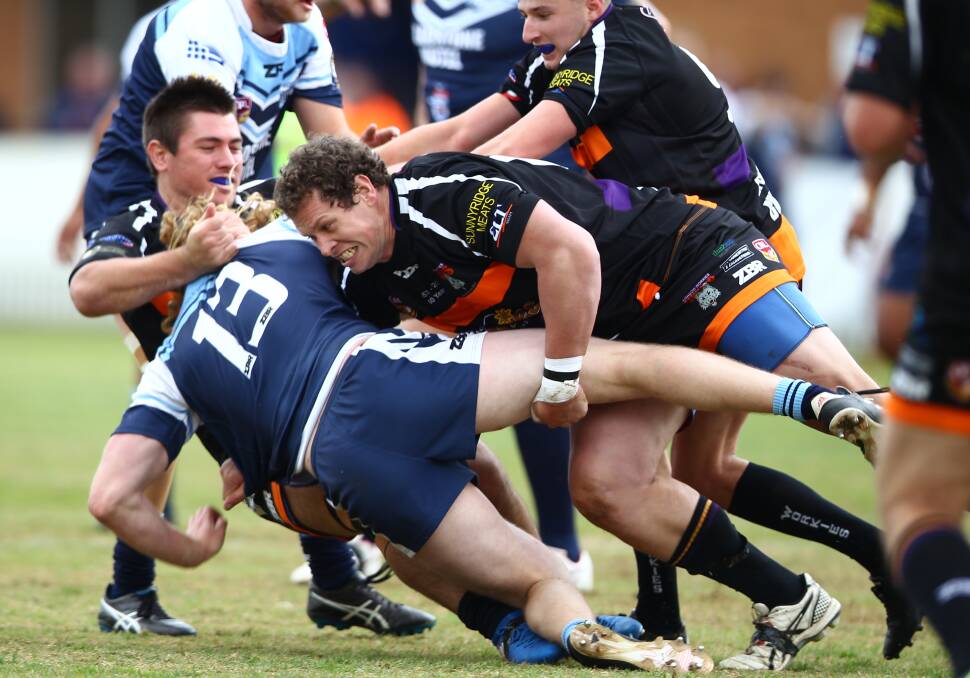 TOP OF THE LOT: Chris Rhodes makes a tough tackle against the Orange Hawks earlier this year. Picture: PHIL BLATCH