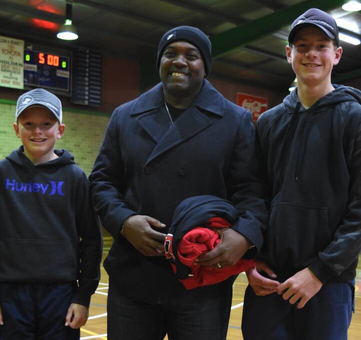 Addison Flynn's father Andre receiving his honorary Lazers gear from Lithgow juniors Hutch and Zeke Evans. Picture: JOHN COX
