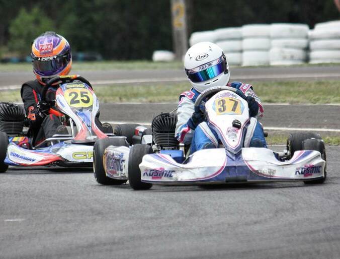 RACE FOR A CAUSE: 2016 KA3 Light division winner Courtney Becker on her way to victory in front of now Aussie Racing Cars driver Charlotte Poynting.