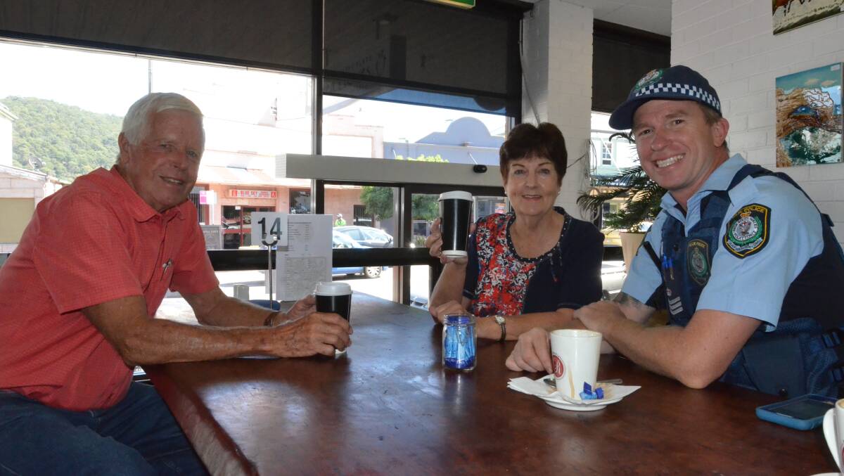 Cuppa time: Barry Lawson and Robyn da Costa enjoy a coffee with Lithgow police office Sergent Matthew Watts. Photo: MARK RAYNER