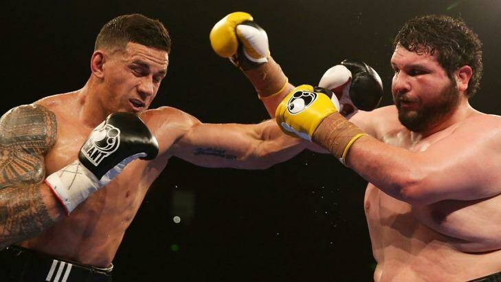 Sonny Bill Williams throws a left at Chauncy Welliver. Photo: Mark Metcalfe