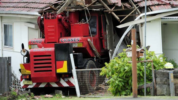 The truck crashes through the front of the house in Pendle Hill. Photo: Brett Hemmings