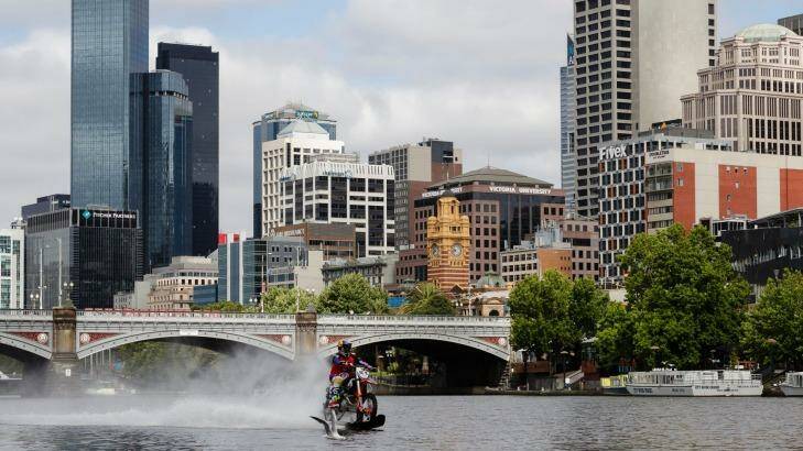 Robbie Maddison rides his modified motorbike along the surface of the Yarra. Photo: Brook Mitchell