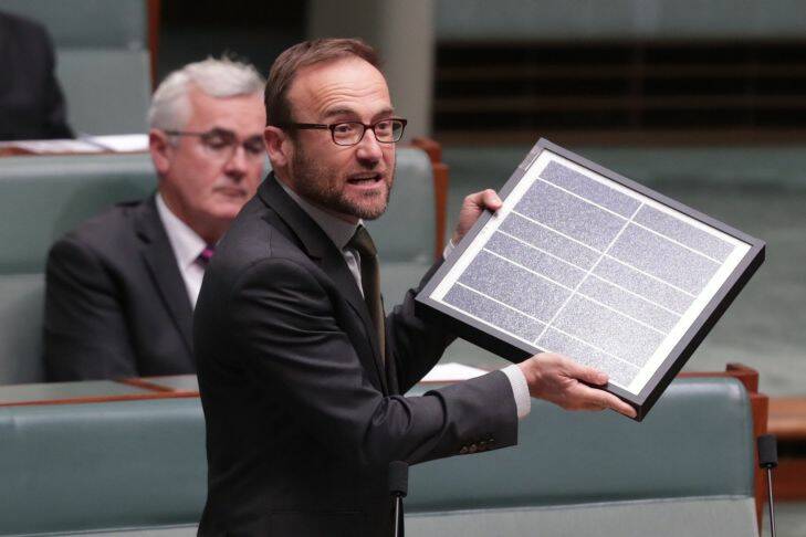 Adam Bandt with a solar panel during question time at Parliament House in Canberra on Monday 13 February 2017. Photo: Andrew Meares  Photo: Andrew Meares