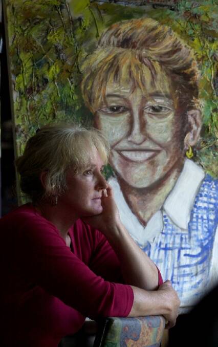020412...SundayTimes...GTidypic...PClack story...Captains Flat cafe owner, Christine Simpson in front of a painting of her 9 year old  daughter Ebony Simpson, painted by partner, Gunther Deix.
