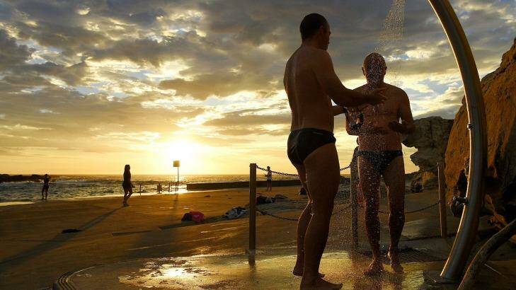 Swimmers rinse off after a swim at Clovelly Beach earlier this month. Photo: Kate Geraghty