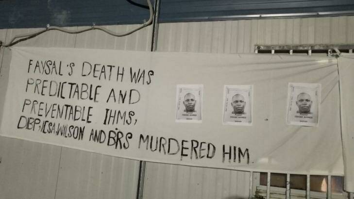 A sign at a memorial service for Faysal Ahmed on Manus Island. Photo: Supplied