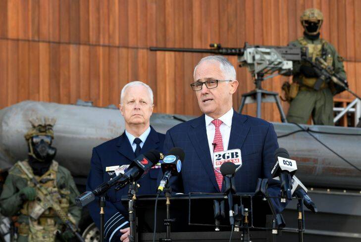 Australian Prime Minister Malcolm Turnbull (right) speaks to the media during a visit to Holsworthy Barracks in Sydney, Monday, July 17, 2017. The Turnbull government is looking to change 'call out' powers to allow the military to help local police deal with terror threats. (AAP Image/Brendan Esposito) NO ARCHIVING