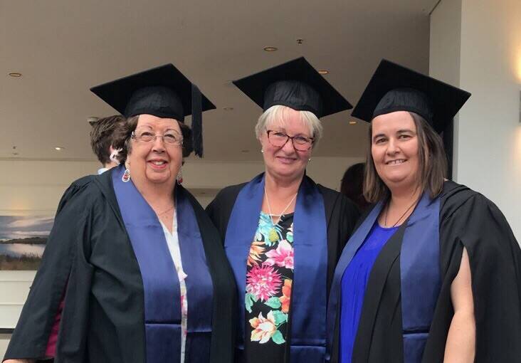FAMILY HISTORY: Lea Wootton, Louise Dean and Karen Brown celebrate their graduation from the University of Tasmania on December 19. 