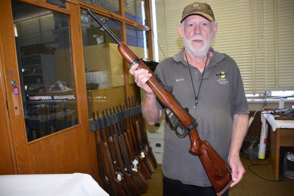 A PIECE OF HISTORY: Lithgow Small Arms Factory's Kerry Guerin in the restricted section of the museum, with the rifle donated last week. 