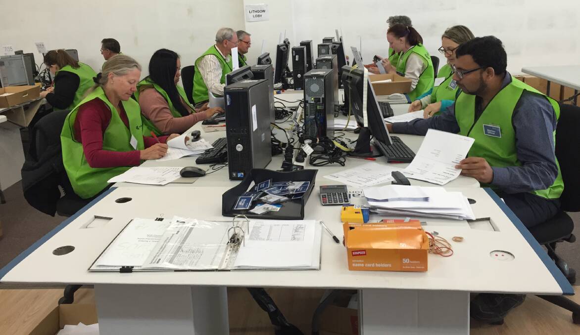 THE COUNT IS ON: Staff at the Lithgow City Council byelection Returning Office hard at it on Monday, April 10.  