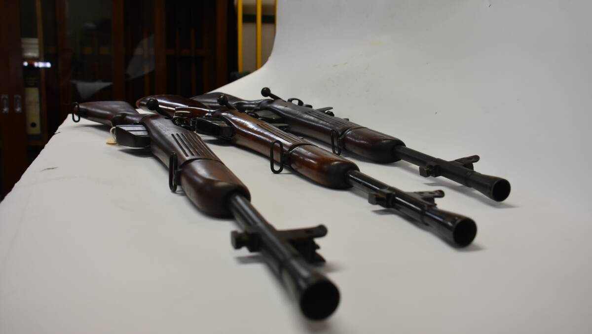 THREE TYPES: The new rifle donated (centre) with two other prototype examples held by the Lithgow Small Arms Factory Museum. 