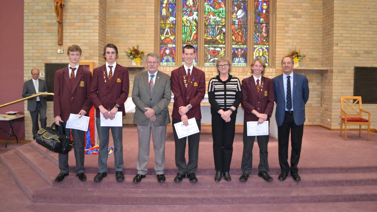 PRIZES FOR INDUSTRY: Bradley Kay, Isaac Fardell, Peter Tracey, Connor Shiel, Jenny Holgate, Dalton Neville and Mark Picman pictured at the Year 12 graduation for La Salle Academy. Picture: SUPPLIED. 
