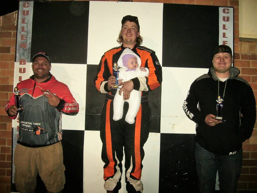ON TOP: Second place winner Chris Marino, first Mitchell Duggan with his baby daughter, and third Corey Foyle.