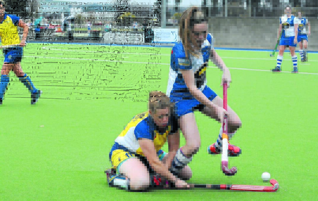 DOWN AND OUT: Ex-Services' Tiffany Atkinson gets tangled up with St Pat's gun Paityn Simpson during Saturday's 2-1 loss to the Bathurst club. Photo: PHILL MURRAY 060416ppats2