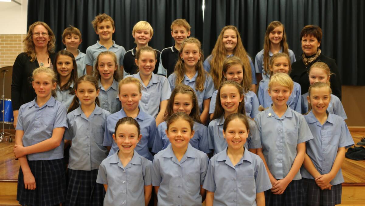 SCHOOLS SPECTACULAR BOUND: The Lithgow Primary School students who will make their way to Sydney Olympic Park in November with music teacher Belinda Trounce (left) and principal Vicki O’Rourke. lm062016sslps
