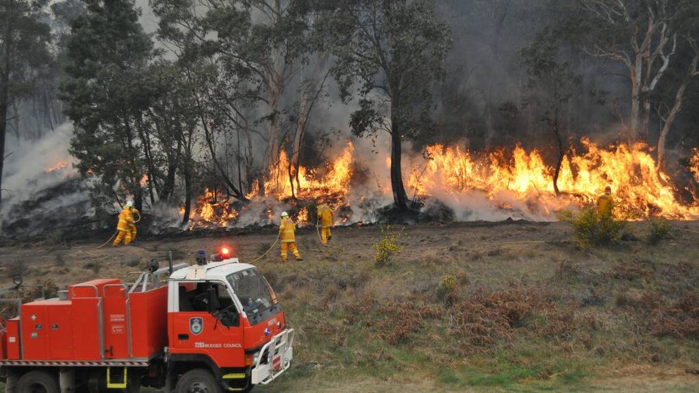 LITHGOW FIRE 2013: RFS units battled flames for over a month after a defence force training program at Marrangaroo Army Camp went terribly wrong. 	lm101114fire5