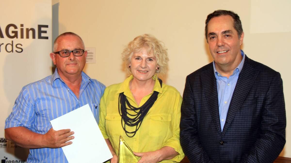 A WINNER IN MORE WAYS THAN ONE: The State Mine Heritage Museum directors Ray and Jennifer Christison accept the 2014 IMAGinE Award from Museums and Galleries NSW Chair Oliver Frankel. 	lm112414museum