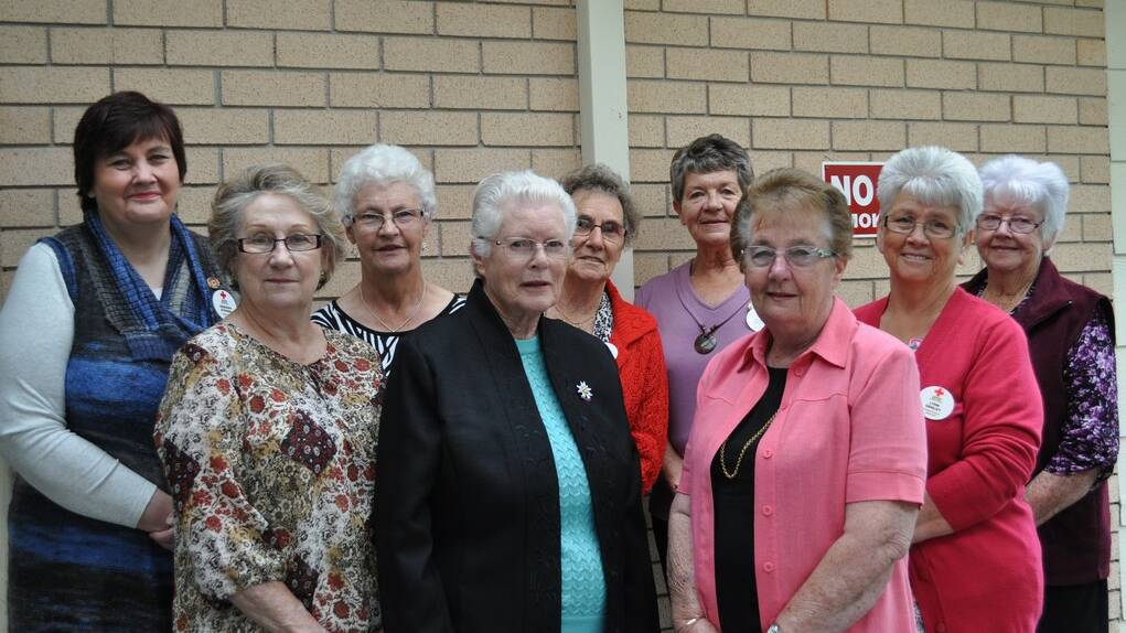 Local community groups and residents enjoy the Portland Red Cross morning tea put before them.