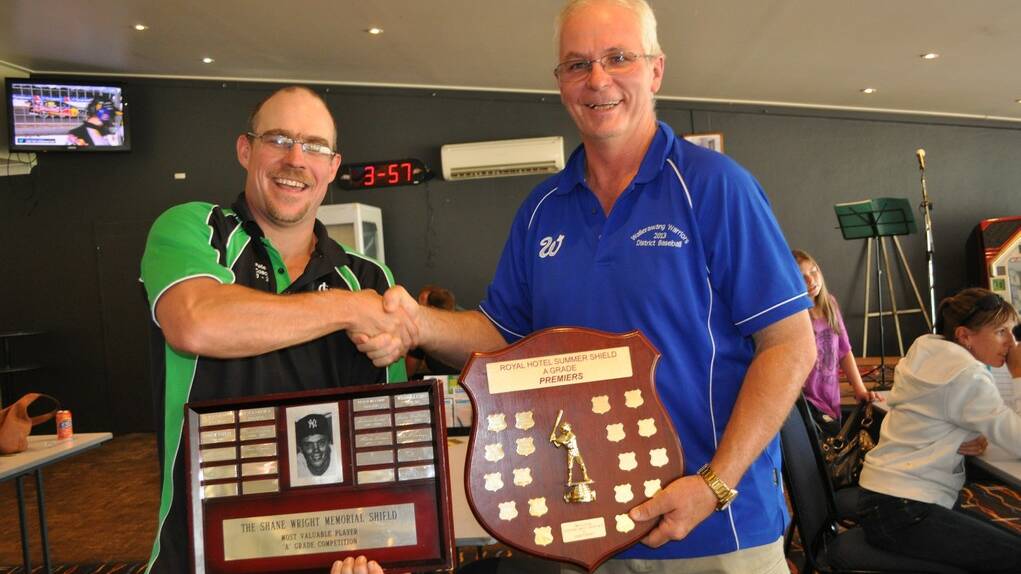 CONGRATULATIONS: Peter Nunan receives the season's trophies from baseball club president Joe Smith 
	lm040114ball10