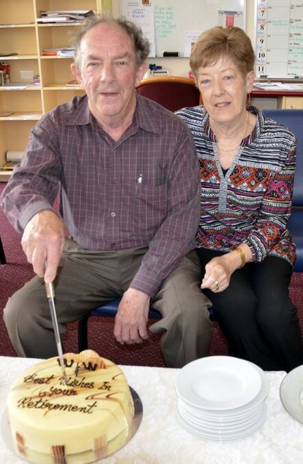 LAST DUTIES: Roger and his wife Denise cut his farewell cake. 	lm101414roger1