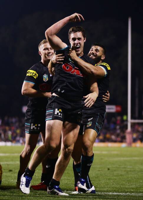 BIG SEASON: Dubbo product Isaah Yeo celebrates scoring a try for Penrith against the Eels earlier this year. Tomorrow he will line up in the second row as the Panthers face Cronulla at Carrington Park. Photo: GETTY IMAGES 072414yeo