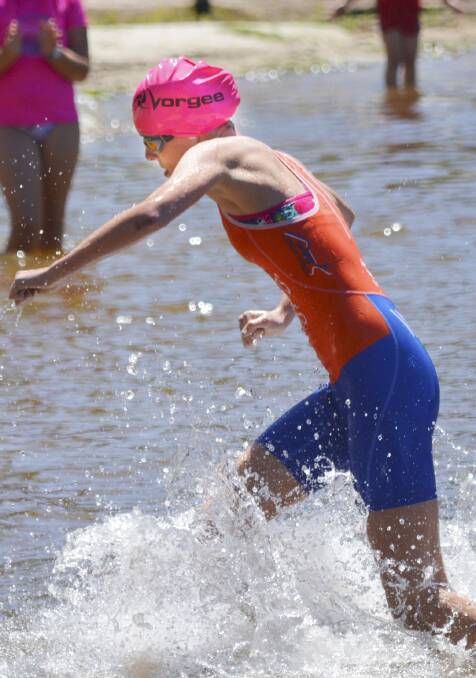 BIG MOTOR: Emily Watts powers out of the water.