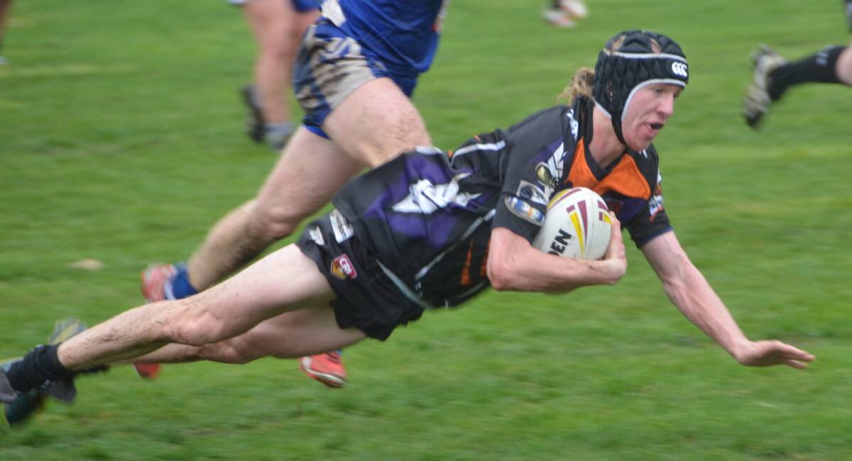 TRY TIME: Wolves’ under 18’s Brad Ford dives over the try line for an excellent try.