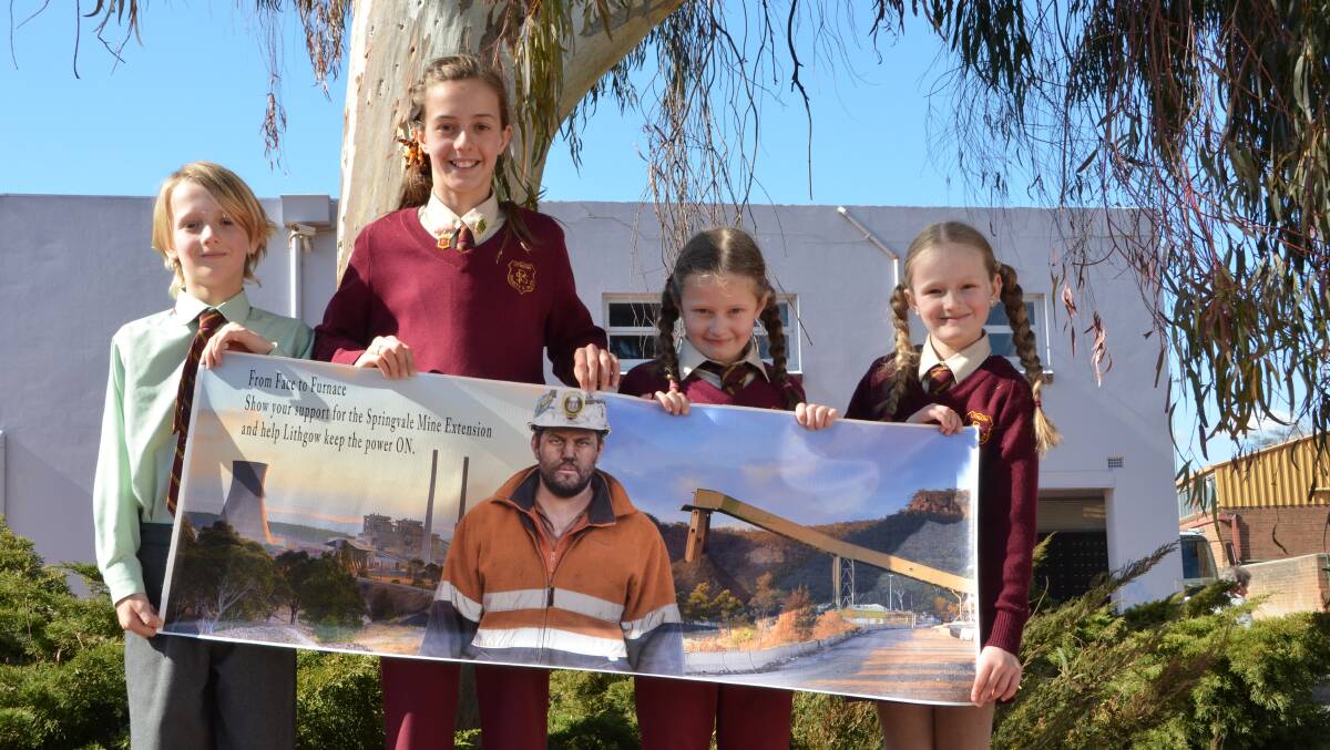 MINERS’ families have joined the campaign to save the Sringvale jobs from further delays. Taj and Meleke Jenkins and Isabelle and Camryn Jones
displayed a poster featuring Springvale miner Luke McManus.