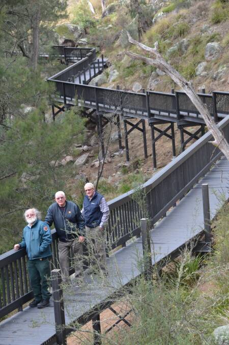 A PRISTINE and historic river gully will be explored on Hartley’s
new boardwalk. Inspecting the near complete project are site manager
Steve King, Trust chairman Bob Morris and Barry Funnell.