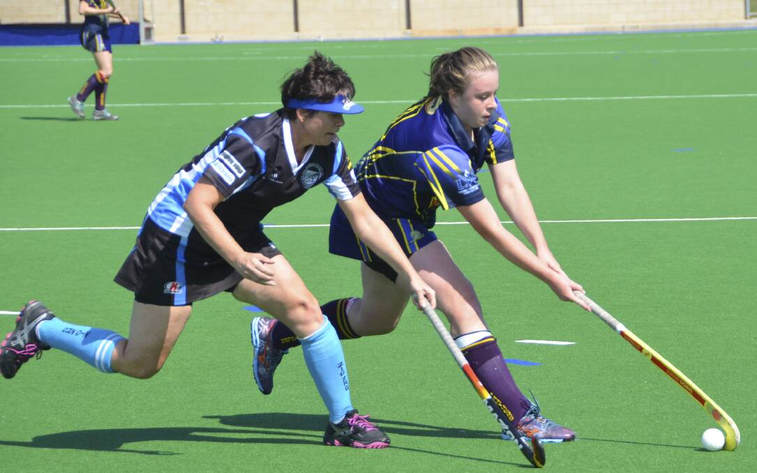 ON THE ATTACK: Panthers’ Keely Newham tries to get away from Ziggies’ Christine Stapleton.