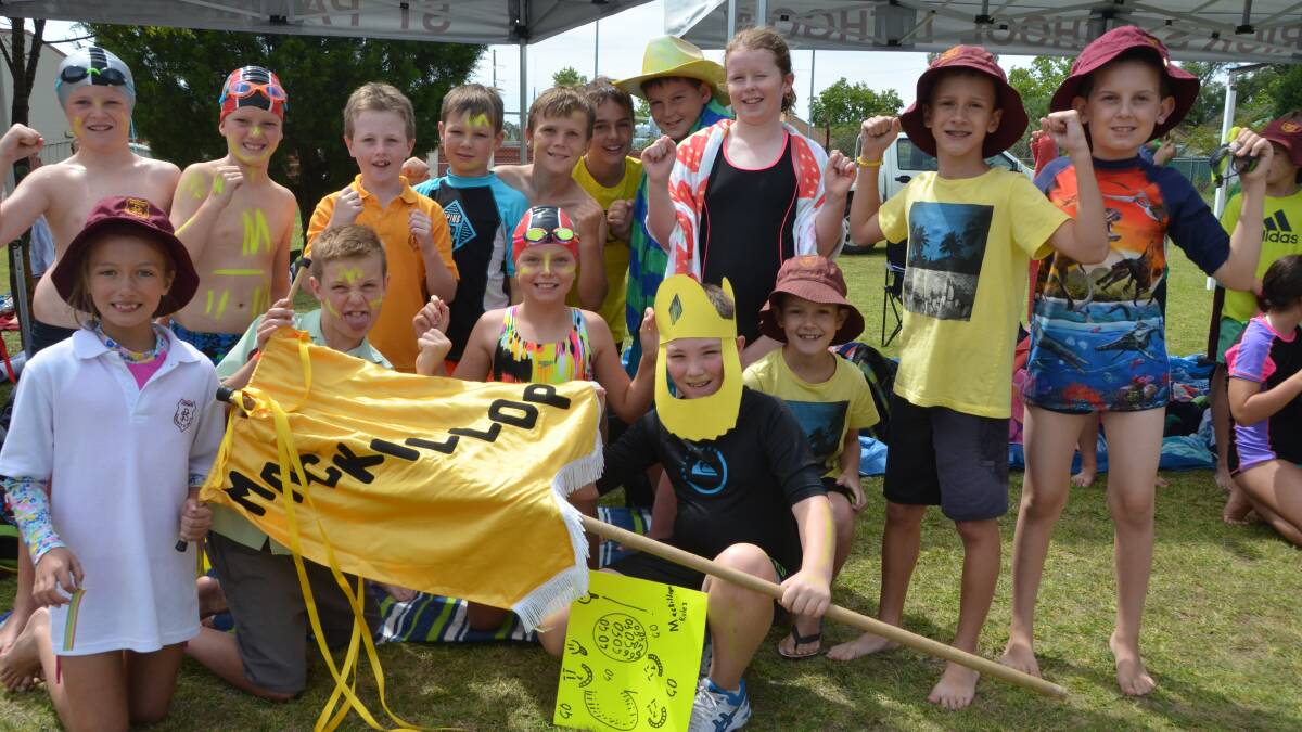 GO MACKILLOP: It was all yellow for these students from the Mackillop House as they gave their support to their swimmers at the St Patrick’s Swimming Carnival.