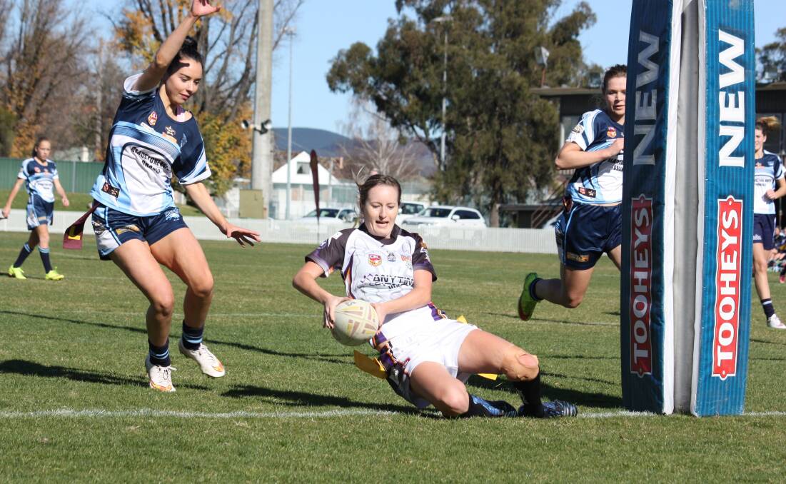 IN FOR A FOUR-POINTER: Ashleigh Oldfield goes over for her League Tag try in the game against Orange Hawks.