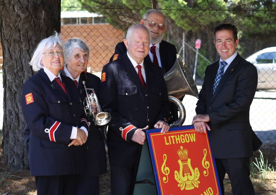 LENDING A HAND: Lithgow City Band musical director Judy Kinnear (left) with band members and Member for Bathurst Paul Toole.