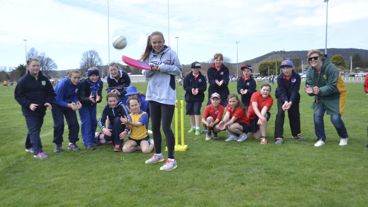 GOOD SKILLS: Lithgow Primary’s Ellie Baxter gives the students from Portland and Lithgow Primary some catching practice under the watchful eye of teacher Christine Wren. 	