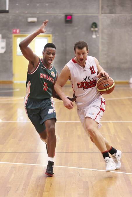 BIG YEAR AHEAD: Lazers’ captain and co-coach Adam Marjoram drives towards the basket. 