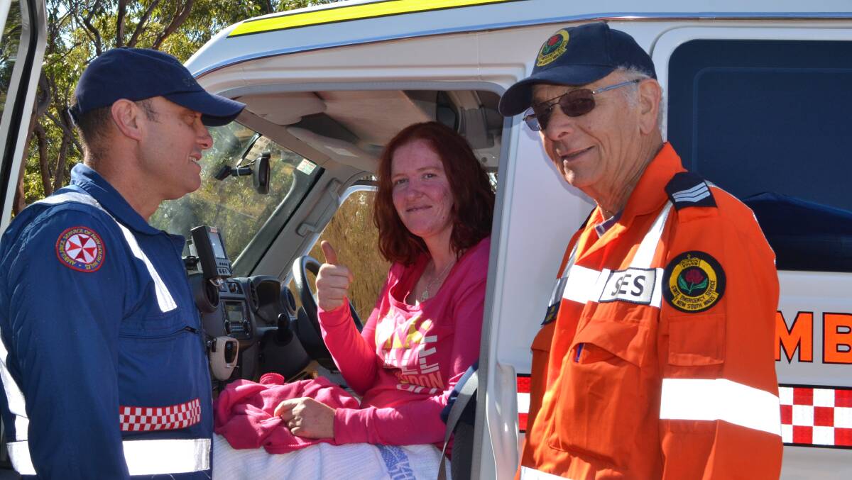 Lydia Johnson of Bowenfels with emergency services personnel