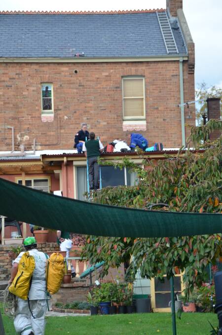 RESCUERS faced a challenge in retrieving an injured man from the roof a house in central Lithgow.