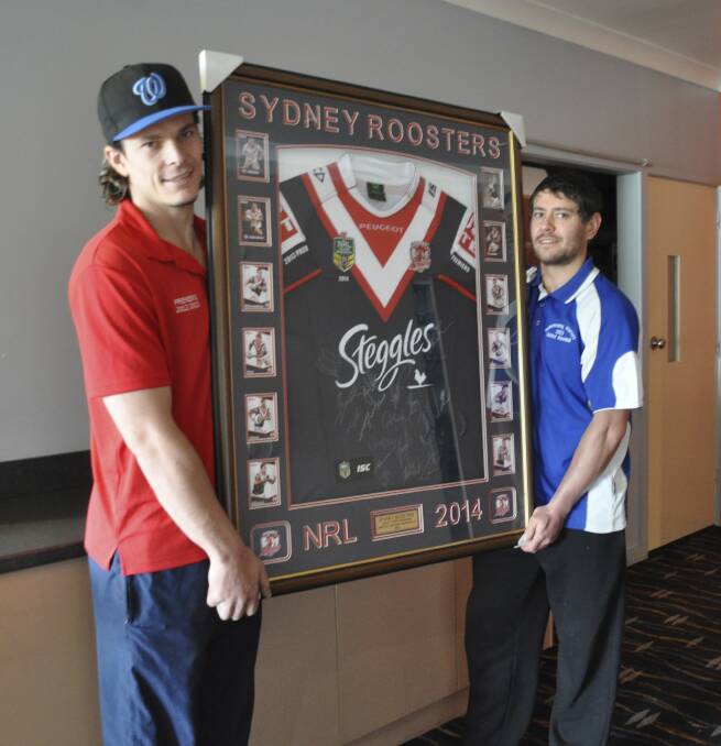 Baseballers Ben Smith and Mark English show off the Roosters jumper
