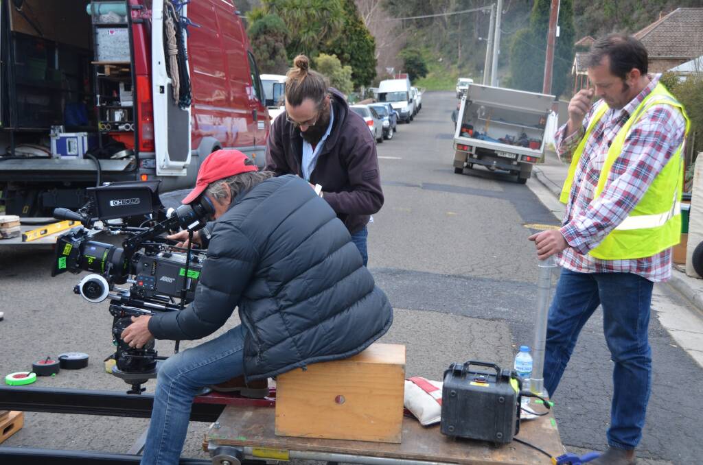 ON THE JOB IN REDGATE STREET: Cameraman Geoff Hall whose credits include wide acclaim for his work on the hugely successful Australian film ‘Red Dog’. 	