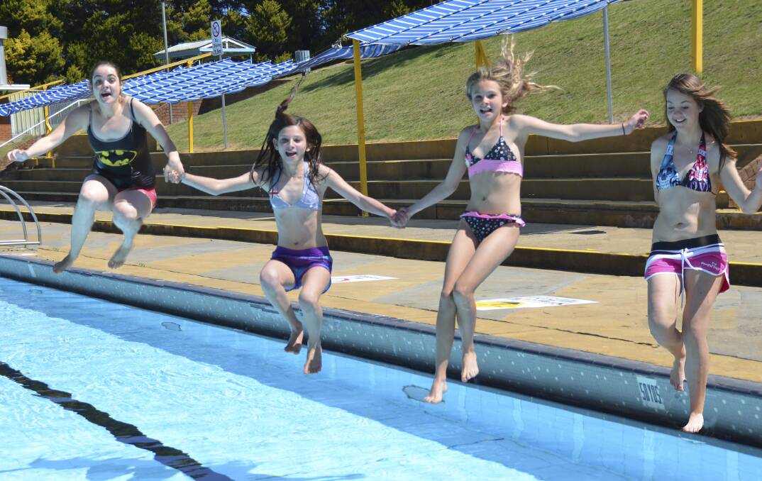 TOGETHER WE PLUNGE: Tiffany Irvin, Shyann and Alana McManus and Caitlin Locker were happy that the pool is now back in action after a cold winter. 
