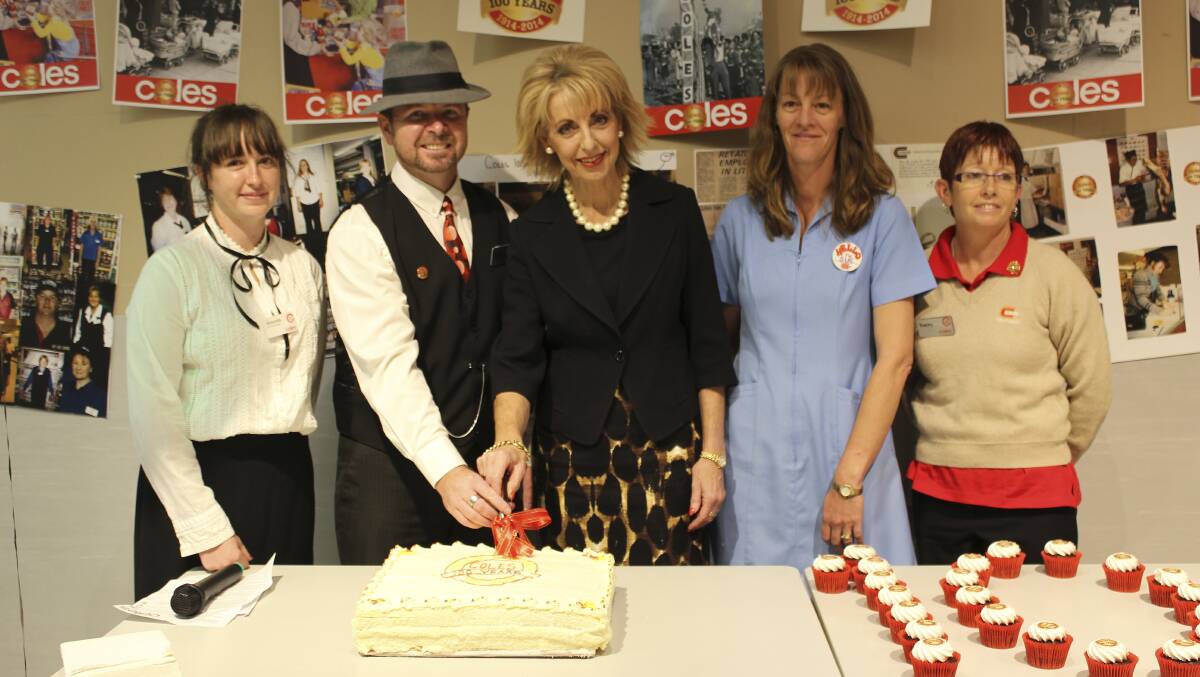 BIRTHDAY CELEBRATIONS: From left Coles’ Amanda Pearce, store manager Craig McGuire, mayor Maree Statham and Coles’ Sue Thompson and Tracey Baker. 	