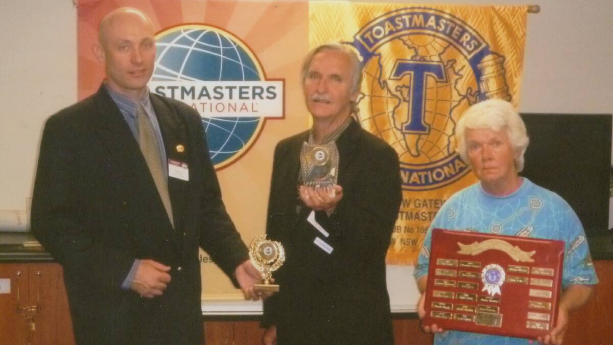 WEIGHED DOWN WITH HER PRIZES: Sheila Riordan, winner of the Area 14 Toastmasters International Humorous Speech and Table Topics Contest, asked third placegetter John Collett (centre) and Area 14 Governor Scott Trist to help support the trophies she won at the speech contest in Bathurst. 