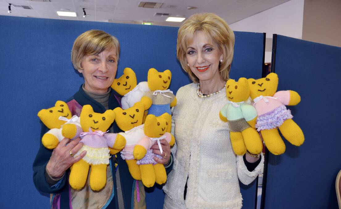 CUTE AND CUDDLY: President Jeanie Cupitt and mayor Maree Statham with part of the batch of teddy bears to be delivered to the various venues.