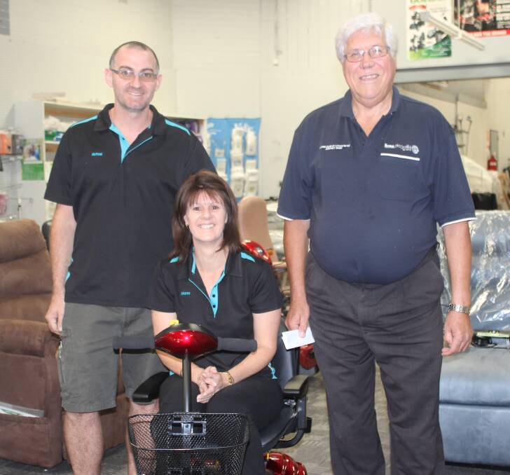 Pictured are Lithgow Mobility Aids' Michael Collins and Maree Van Harskamp with Lions president Alex Roberts (at right) showing off Noel Yeo's new mobility scooter. 