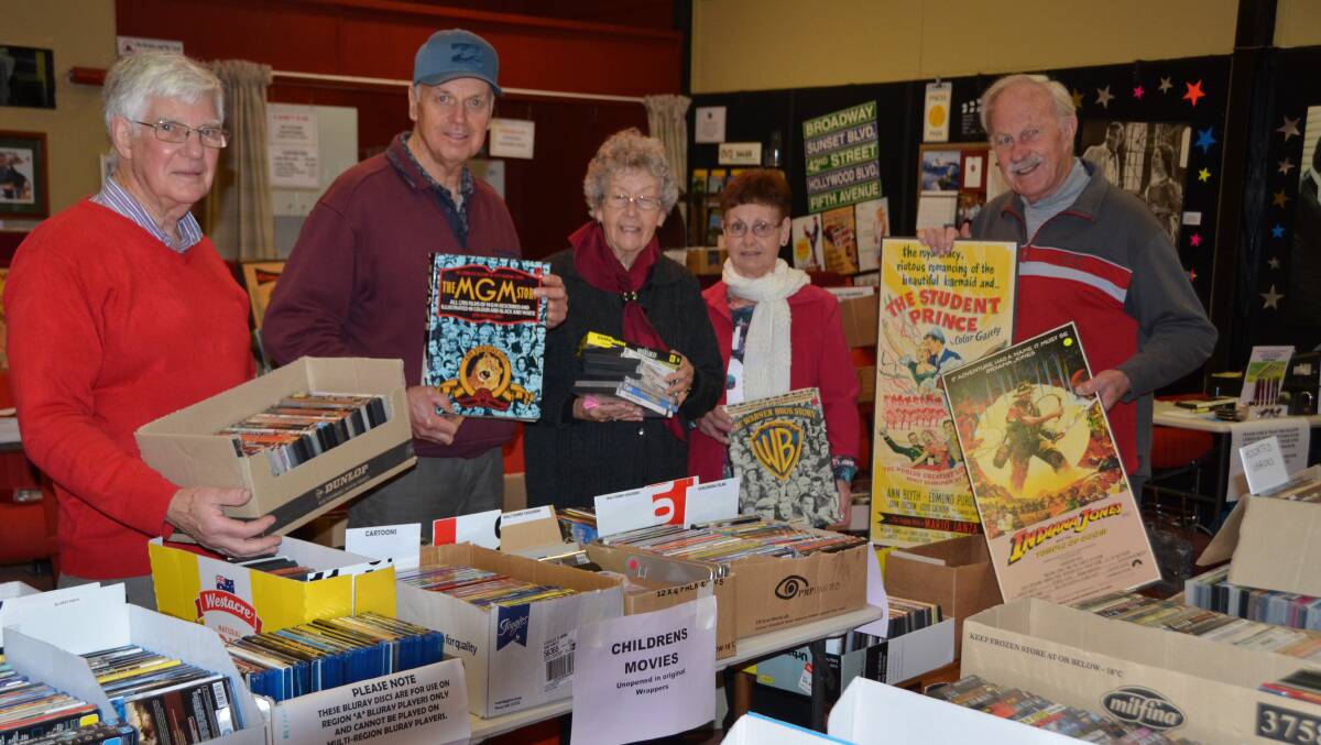 HELPING to sort the collection are cinema members Ross Adams, Leo Vliegenthart, Pat Cooper, Liz Lovett and Al Ritchie.